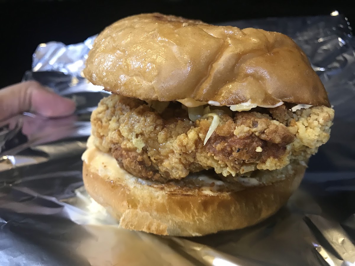 Hogger's Den crispy fried chicken burger, wrapped in foil